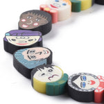 BS0085 Bead Strand Polymer Clay Faces Mixed 10-14x10-15x4mm Approximately 30 Pieces Per Strand