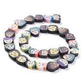 BS0085 Bead Strand Polymer Clay Faces Mixed 10-14x10-15x4mm Approximately 30 Pieces Per Strand